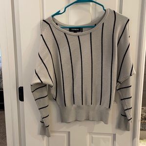 Gray and black striped sweater.